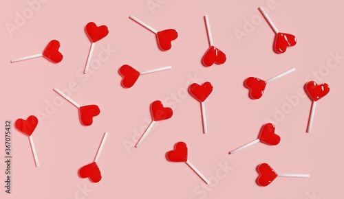 red heart lollipops on a pink background 3d render photo