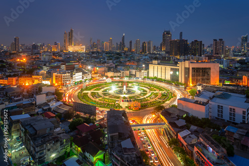 Top view of Wongwian Yai. Roads shape traffic circle in Thonburi, on the west bank of the Chao Phraya River in Bangkok in Thailand, during twilight time.