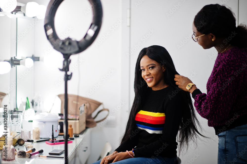 African American woman applying hairdresser or hairstylist at beauty