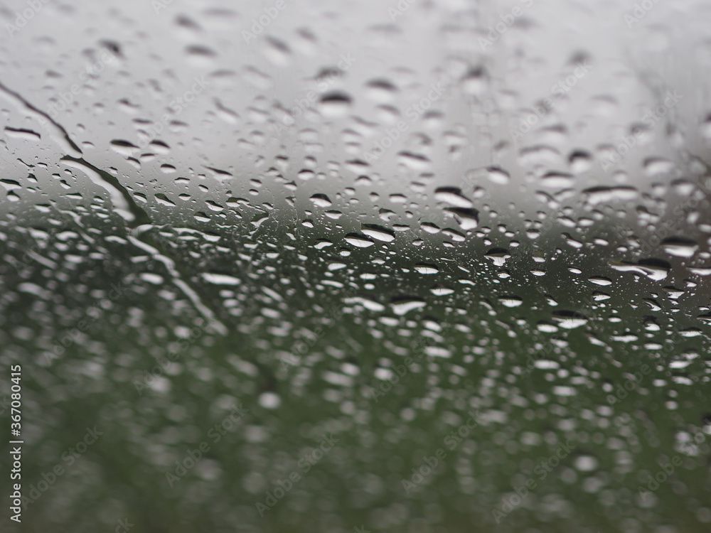 Motion drop rain on mirror window glass car in road rainy season Motion drop rain on mirror window glass car in road rainy season