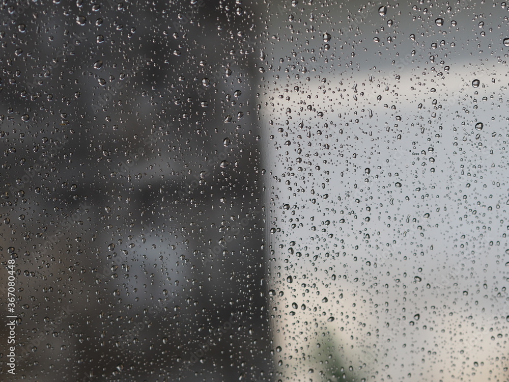 Motion drop rain on mirror window glass car in road rainy season Motion drop rain on mirror window glass car in road rainy season