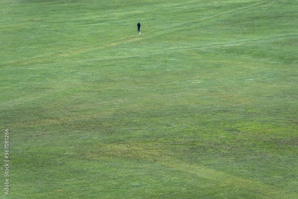 Green lawn of Parade Ground park, view from Holyrood Park in Edinburgh city, Scotland, UK Green lawn of Parade Ground park, view from Holyrood Park in Edinburgh city, Scotland, UK