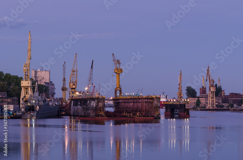 SHIPYARD - Harbor cranes and repair dock at dawn