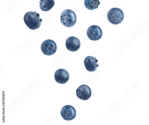 Fresh ripe blueberries falling on white background