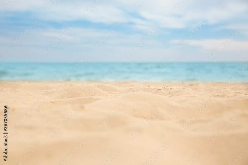 Beautiful sandy beach and sea on sunny day, closeup. Summer vacation