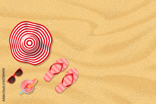 Summer time. Sand texture. Top view. Hat, sunglasses, flip flops, cocktail. View from above. 