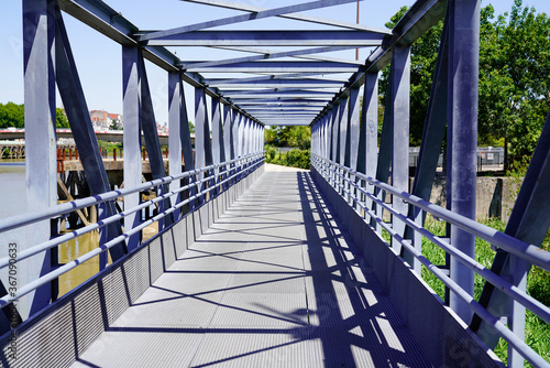 Overground Pedestrian Metal Crossing steel bridge walkway with Modern building perspective