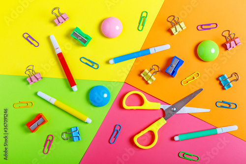 Various school supplies on a colorful background. Back to school concept. Learning and education concept. Stationery store concept. Bright creative school background. Top view, flat lay.
