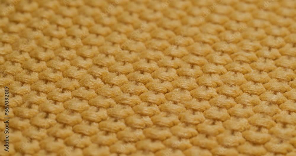 Yellow knitted duvet texture close up Yellow knitted duvet texture close up