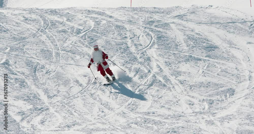Authentic Santa Claus in red costume having a vacation. Santa skiing in winter mountains, relaxing before bringing presents - christmas 4k footage Authentic Santa Claus in red costume having a vacation. Santa skiing in winter mountains, relaxing before bringing presents - christmas 4k footage