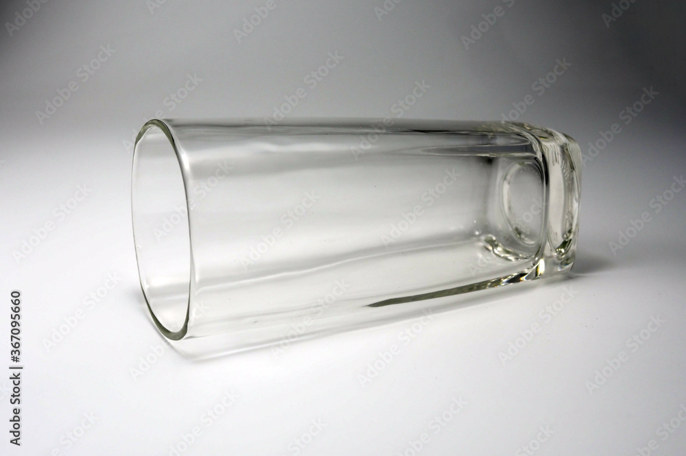 Empty glass Lying on a white background.