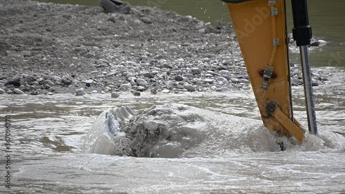 Wallpaper Mural Close up excavator digging sand pebbles from the river. Heavy industry and environment. Ecological disaster. Water pollution. Machine dredging river canal. Dam building. Slow motion, static shot Torontodigital.ca