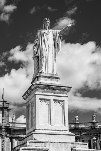 Monument to Dante Alighieri erected in 1865 to celebrate the 600 year anniversary of the birth of the poet Dante, tatue of Dante Alighieri in Dante Square, Naples, Italy