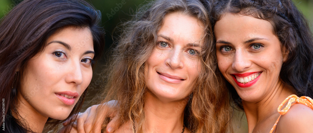 Three young beautiful women as friends together outdoors Three young beautiful women as friends together outdoors