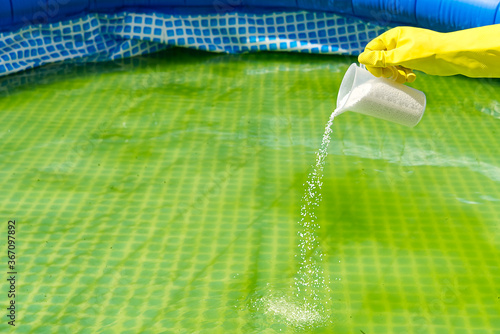 Canvas Print addition of chlorine powder for the pool to remove algae and disinfect water