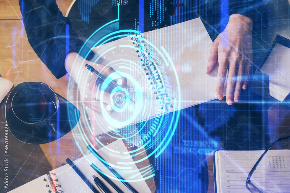 Double exposure of writing hands on background with data solution hologram on front. Technology concept. Close up Double exposure of writing hands on background with data solution hologram on front. Technology concept. Close up