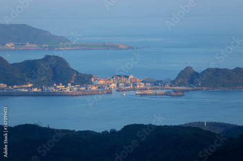 A fishing boat navigate back to harbour from Pacific ocean near Jiufen, Taiwan.