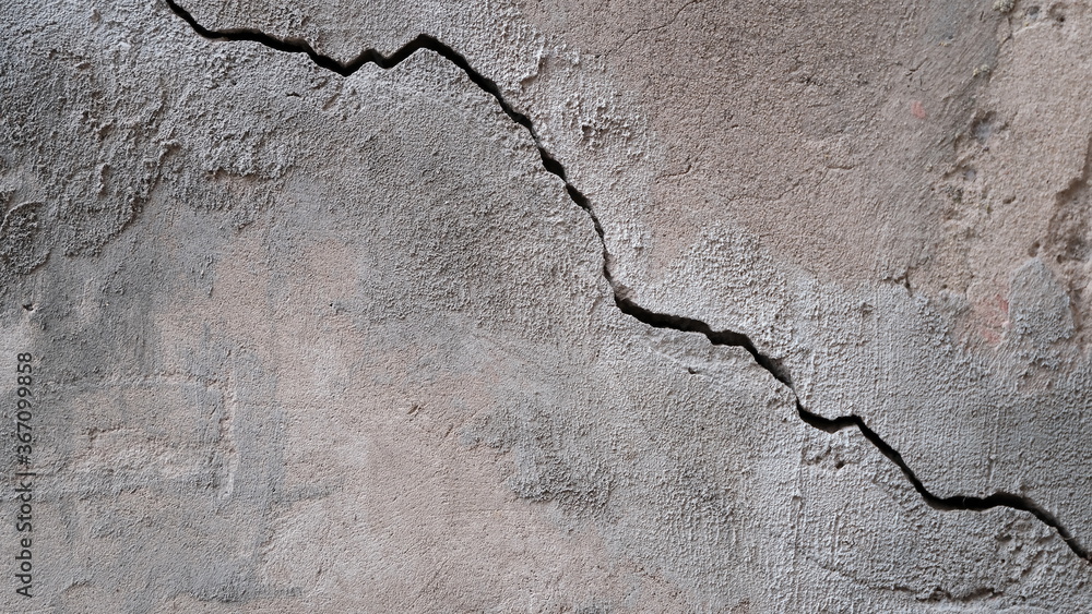 Fototapeta premium Building wall concrete surface. Crack. Background image for web design. 