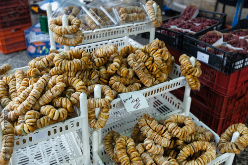 Dried figs on a string in souk street market. Figs in backet on a counter