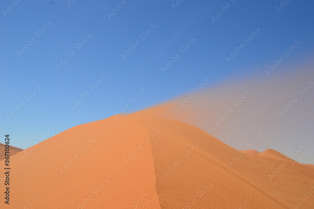 The red sand dunes of Sossusvlei in the Namib Desert, Namibia The red sand dunes of Sossusvlei in the Namib Desert, Namibia