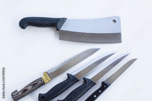 A group of knives of different sizes on white ground,close up photo