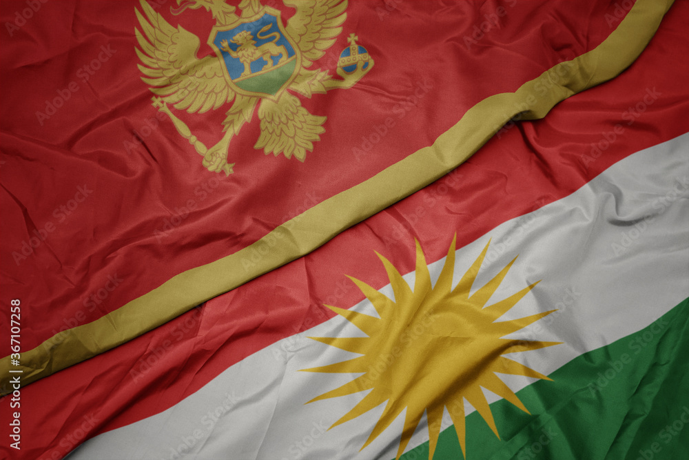 waving colorful flag of kurdistan and national flag of montenegro.