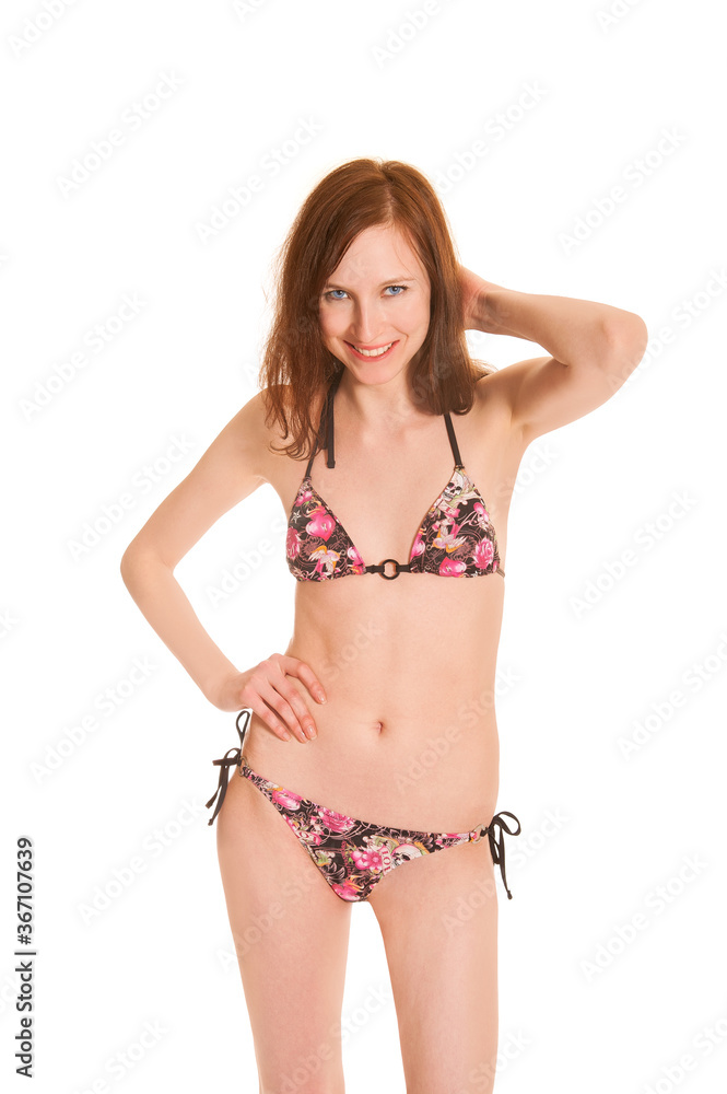 Closeup portrait of a beautiful smiling woman wearing a colorful bikini, isolated on white studio background Closeup portrait of a beautiful smiling woman wearing a colorful bikini, isolated on white studio background