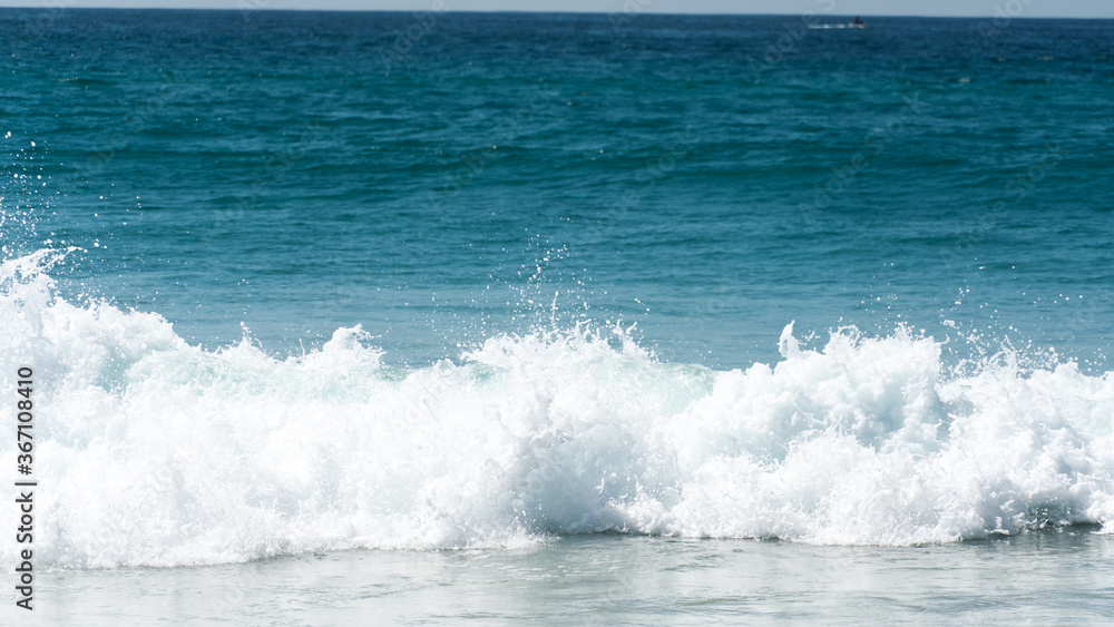 blue crashing waves on the beach blue crashing waves on the beach