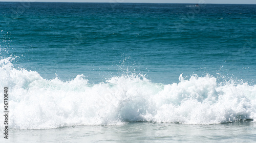 blue crashing waves on the beach