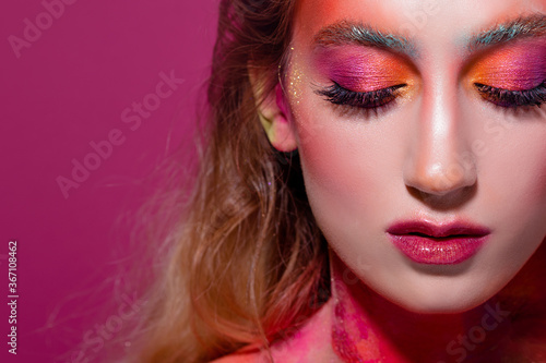 Bright makeup and face art  close-up portrait  girl with closed eyes. Creative makeup 