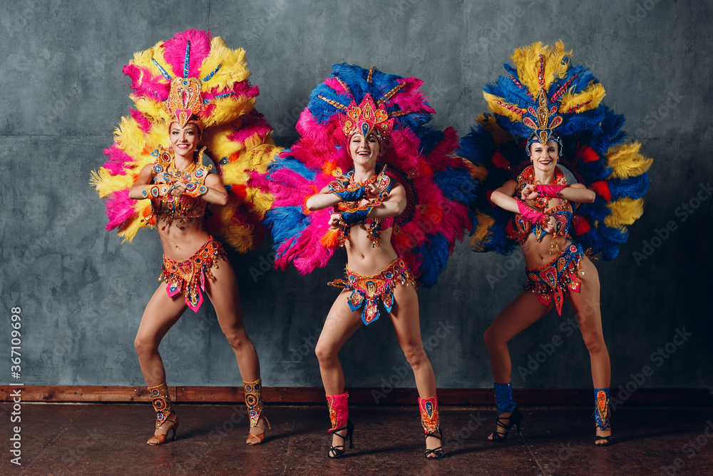 Three Woman dancing in brazilian samba carnival costume with colorful ...
