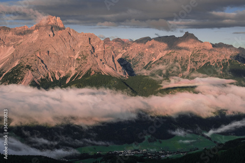 Outstanding early morning view of the Sesto Dolomites in Italy as seen from Sillianer refuge on the Carnic Alps ridge on the Austrian Italian border, Carnic Highroute trek, South Tirol, Austria.