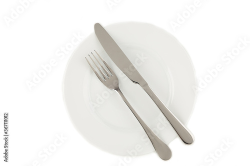 Dining etiquette - the meal is over or finished. Fork and knife signals with location of cutlery set. Photo isolated on white background. Set of foto 7 from 7