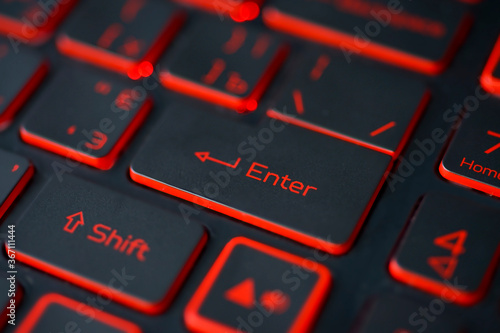 Cuadro en lienzo Red backlit computer keyboard macro shot of enter key