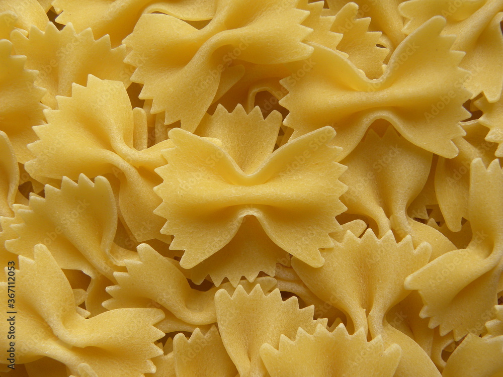 Yellow color raw whole Bow tie pasta Yellow color raw whole Bow tie pasta