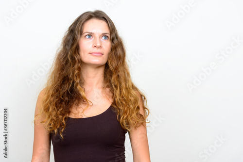 Portrait of young beautiful woman with curly blond hair