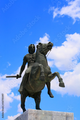  Alexander The Great statue against blue sky and clouds 