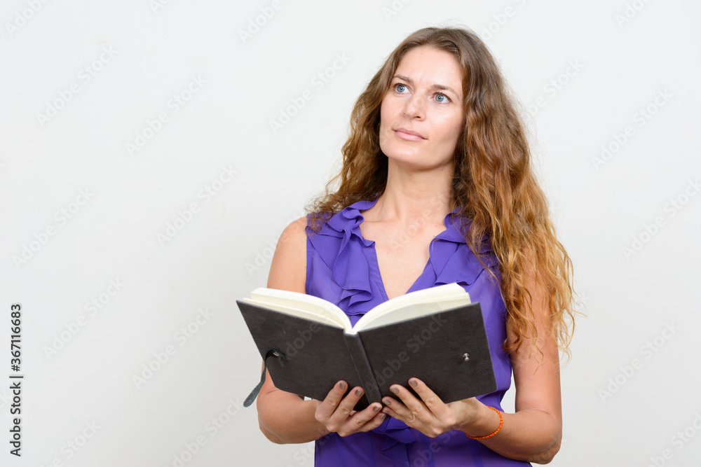 Portrait of young beautiful businesswoman with curly blond hair Portrait of young beautiful businesswoman with curly blond hair