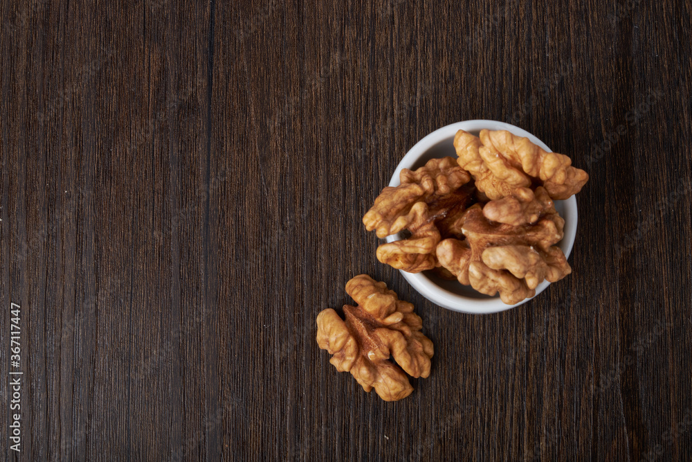 Walnut kernels on a wooden background. Walnut kernels on a wooden background.
