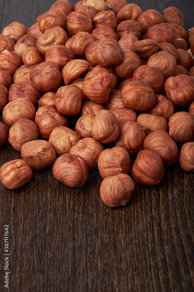 Walnut kernels on a wooden background.Almonds, walnuts and hazelnuts in bowls on a wooden background Walnut kernels on a wooden background.Almonds, walnuts and hazelnuts in bowls on a wooden background
