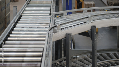Conveyor with few line in distribution warehouse © olegosp