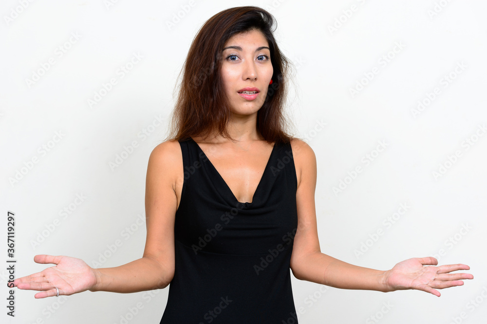 Portrait of young beautiful woman looking confused