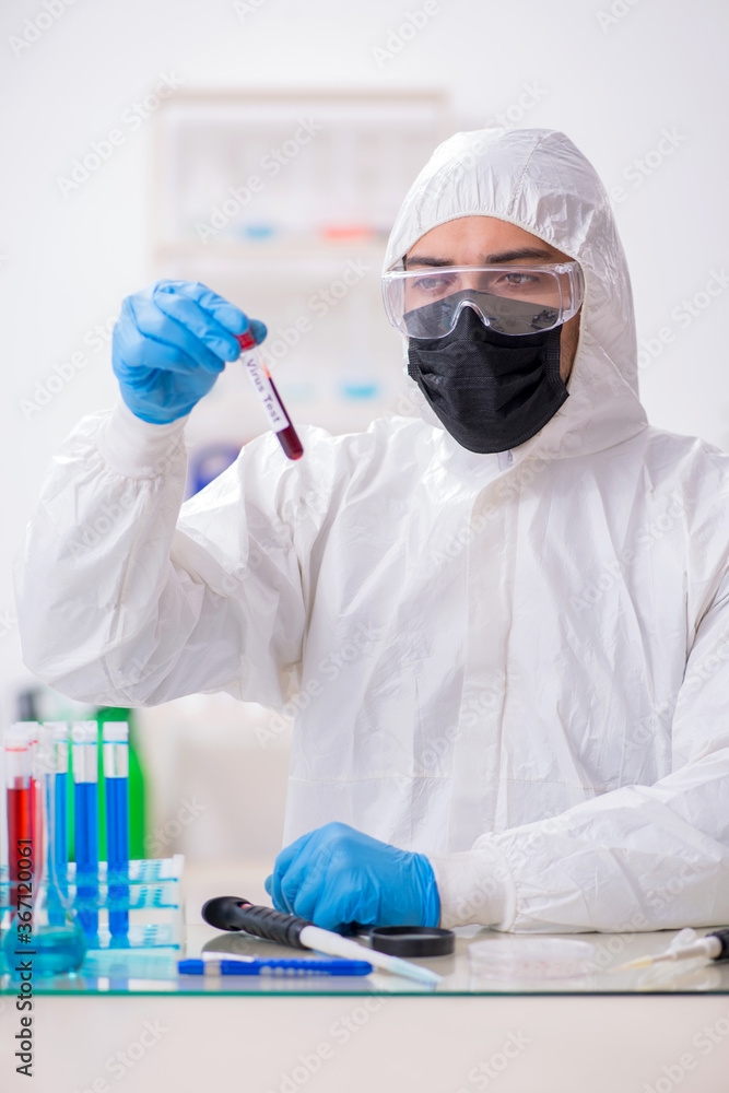 Young male chemist working in medicine lab Young male chemist working in medicine lab