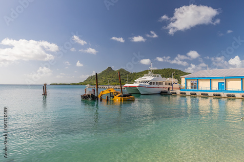 Dredging, pontoon excavator sunk in harbor in Carriacou, Grenada