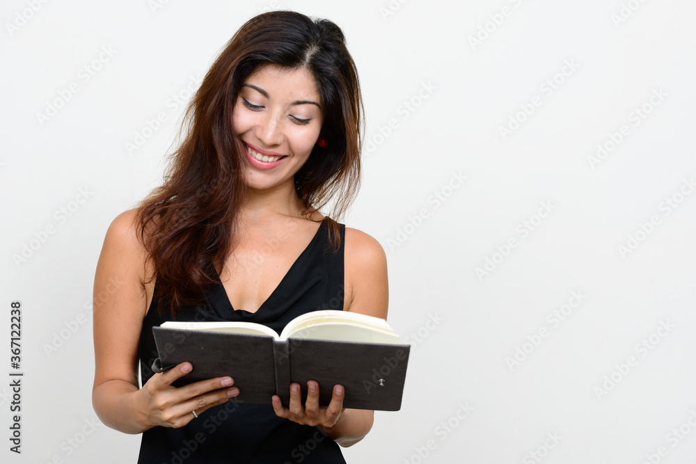 Portrait of happy young beautiful woman reading book Portrait of happy young beautiful woman reading book