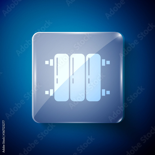 White Heating radiator icon isolated on blue background. Square glass panels. Vector Illustration.