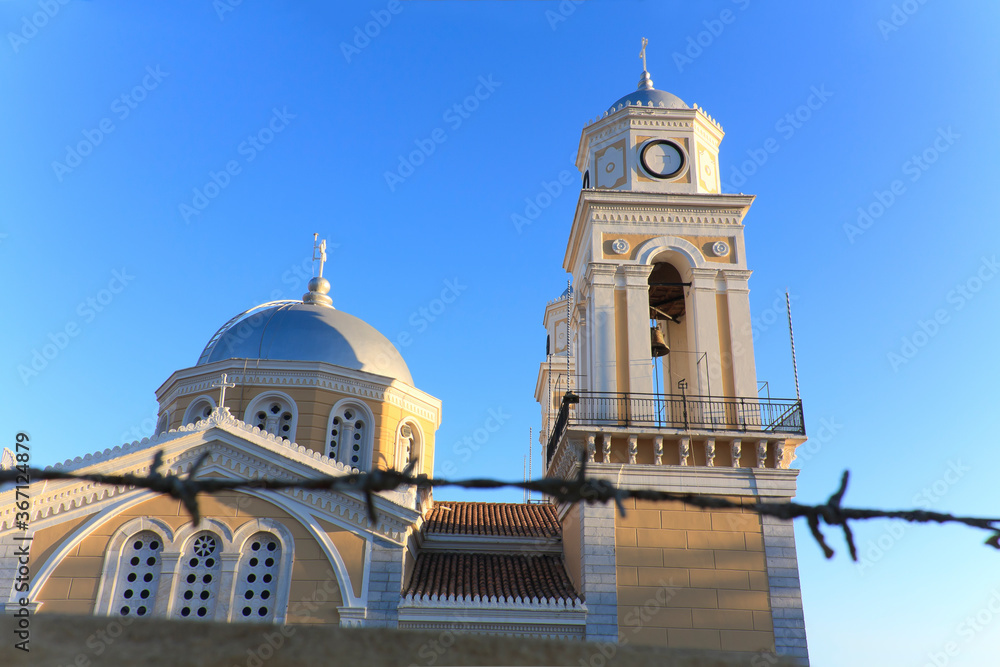 Fototapeta premium Church viewed through thorny fence