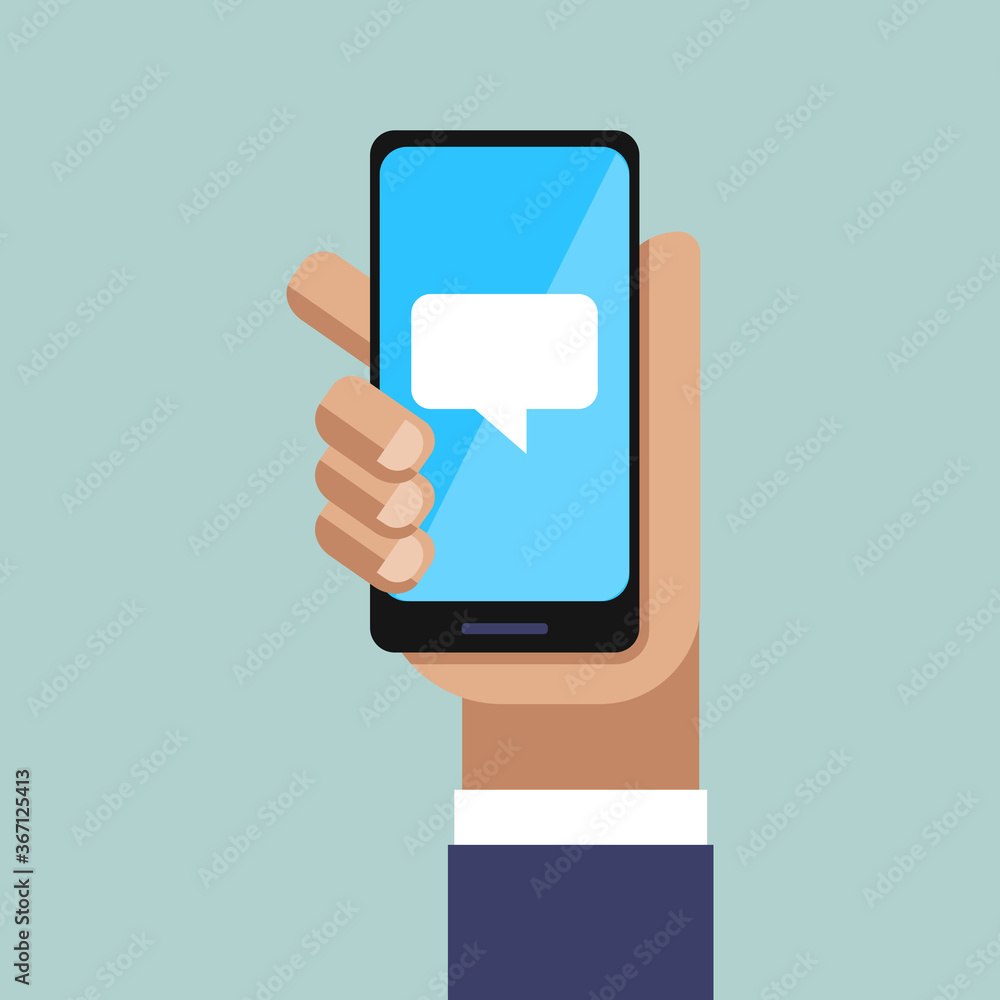 Hand and Smartphone. Chat Message on Phone Screen Hand and Smartphone. Chat Message on Phone Screen