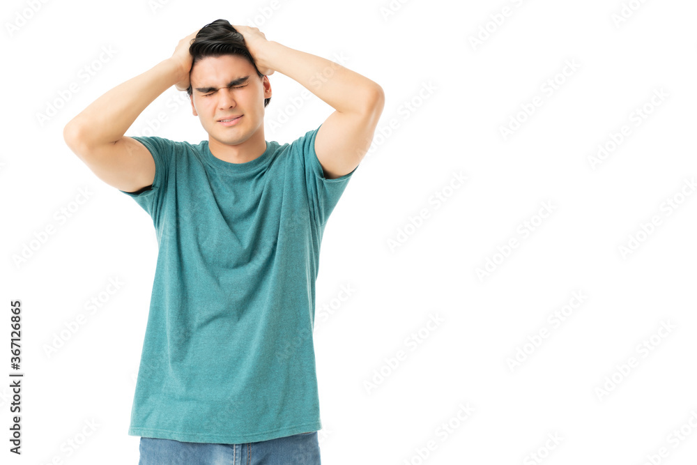 Frustrated Man Standing With Head In Hands Frustrated Man Standing With Head In Hands