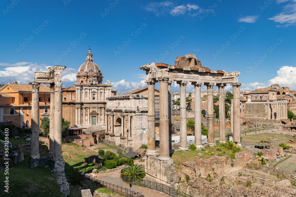 Panorama of roman forum the heart of roman empire. From the Campidoglio they can be seen the Arch of Severus, the temples Saturn and Vesta, Basilica of Maxentius, Arch of Titus, Colosseum Rome, Italy.
